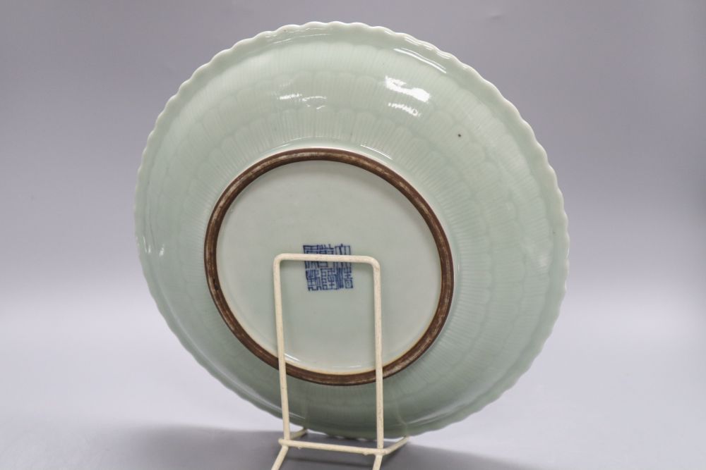 A Chinese celadon glazed dish, 18th / 19th century, Qianlong mark, diameter 28cm